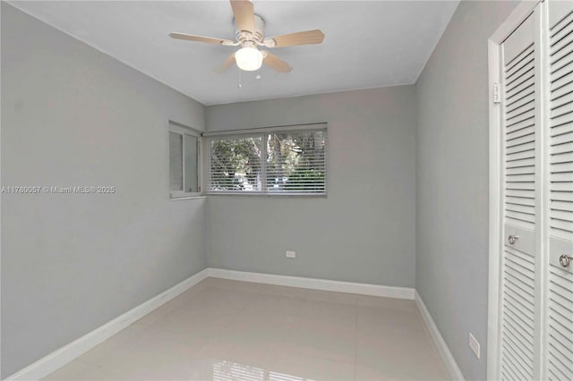 13130 NW 1st Ave, Miami, FL 33168 - unfurnished bedroom with tile patterned flooring, baseboards, a closet, and a ceiling fan
