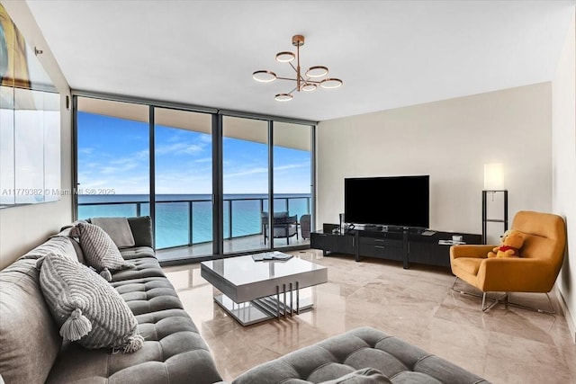 3101 S Ocean Dr Unit 2307, Hollywood, FL 33019 - living room with a notable chandelier and a wall of windows