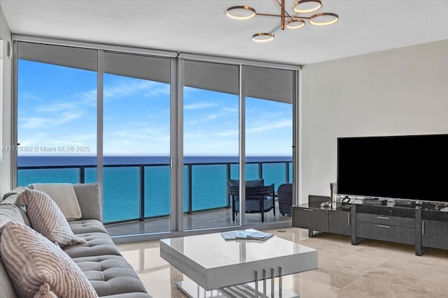 3101 S Ocean Dr Unit 2307, Hollywood, FL 33019 - living area with a chandelier and a wall of windows
