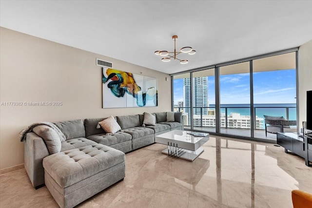 3101 S Ocean Dr Unit 2307, Hollywood, FL 33019 - living area with visible vents, baseboards, an inviting chandelier, and floor to ceiling windows