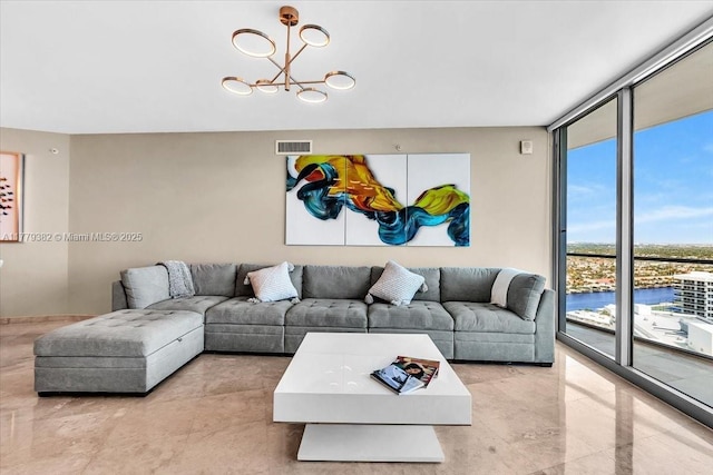3101 S Ocean Dr Unit 2307, Hollywood, FL 33019 - living room featuring visible vents, a notable chandelier, and floor to ceiling windows