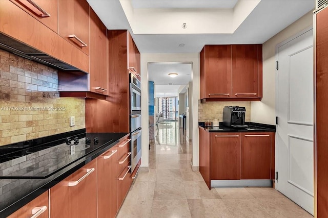 3101 S Ocean Dr Unit 2307, Hollywood, FL 33019 - kitchen featuring tasteful backsplash, black electric stovetop, and dark countertops