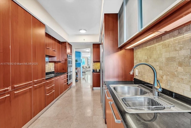 3101 S Ocean Dr Unit 2307, Hollywood, FL 33019 - kitchen with a sink, backsplash, dark countertops, and modern cabinets