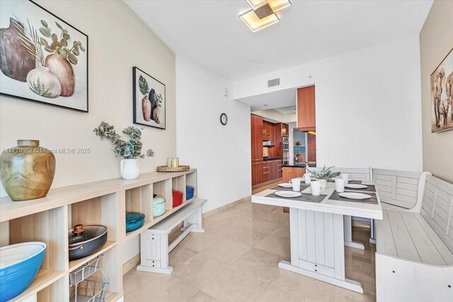 3101 S Ocean Dr Unit 2307, Hollywood, FL 33019 - dining room featuring baseboards and visible vents