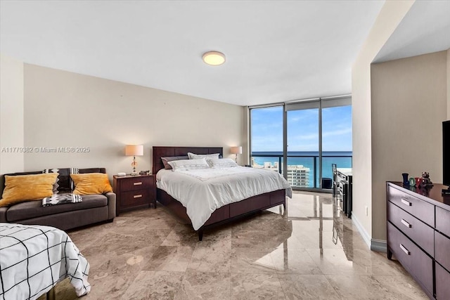 3101 S Ocean Dr Unit 2307, Hollywood, FL 33019 - bedroom featuring baseboards, marble finish floor, and floor to ceiling windows