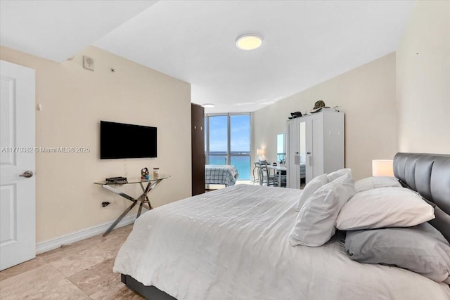 3101 S Ocean Dr Unit 2307, Hollywood, FL 33019 - bedroom with expansive windows and baseboards