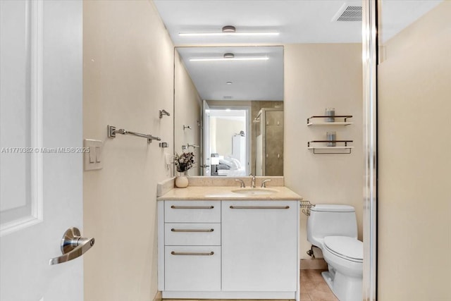3101 S Ocean Dr Unit 2307, Hollywood, FL 33019 - ensuite bathroom featuring vanity, a stall shower, tile patterned flooring, toilet, and visible vents
