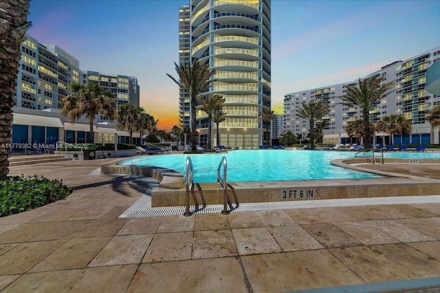 3101 S Ocean Dr Unit 2307, Hollywood, FL 33019 - pool at dusk with a community pool and a view of city