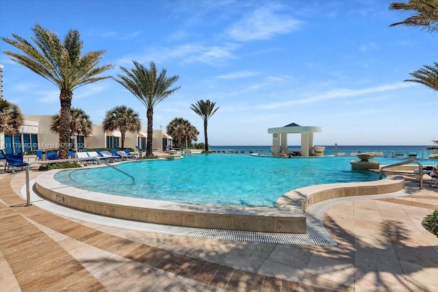 3101 S Ocean Dr Unit 2307, Hollywood, FL 33019 - community pool featuring a water view and a patio