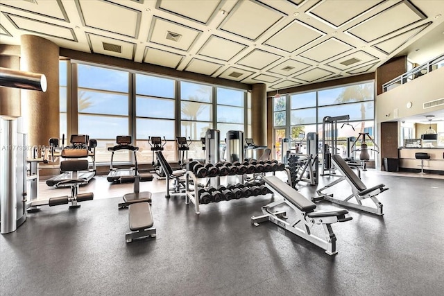 3101 S Ocean Dr Unit 2307, Hollywood, FL 33019 - workout area featuring a towering ceiling, visible vents, coffered ceiling, and a wall of windows