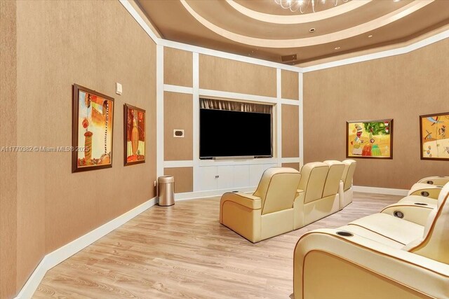 3101 S Ocean Dr Unit 2307, Hollywood, FL 33019 - home theater featuring light wood-style floors, a towering ceiling, and baseboards