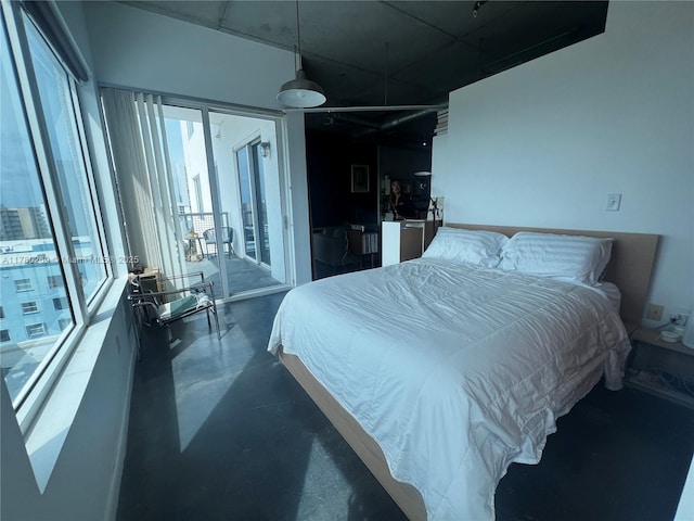 10 SW S River Dr Unit 812, Miami, FL 33130 - bedroom featuring access to exterior and concrete floors