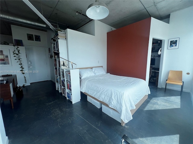 10 SW S River Dr Unit 812, Miami, FL 33130 - bedroom featuring concrete flooring and a walk in closet
