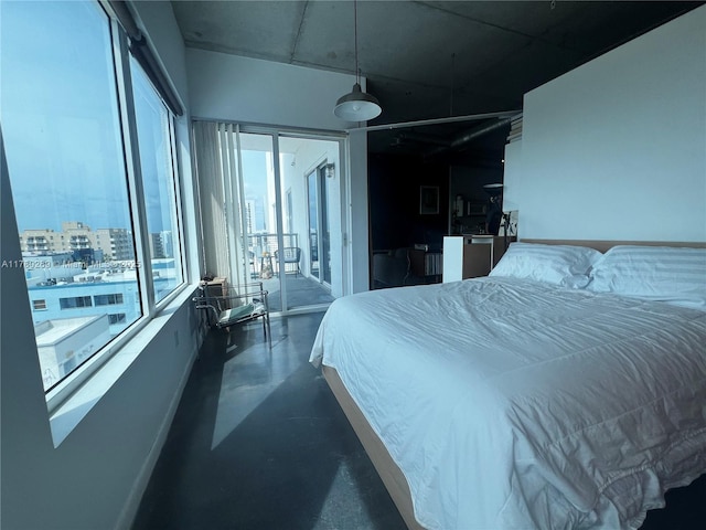 10 SW S River Dr Unit 812, Miami, FL 33130 - bedroom with finished concrete flooring, access to outside, and a view of city