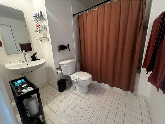 10 SW S River Dr Unit 812, Miami, FL 33130 - full bathroom featuring toilet, tile patterned flooring, and baseboards