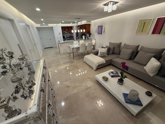 9499 Collins Ave Unit 411, Surfside, FL 33154 - living area featuring recessed lighting and light marble finish floors