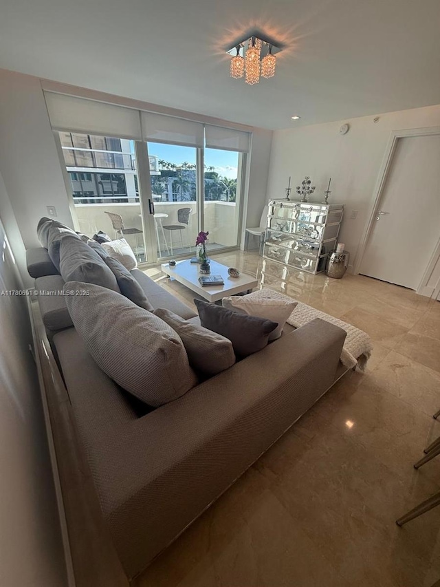 9499 Collins Ave Unit 411, Surfside, FL 33154 - living area featuring a chandelier