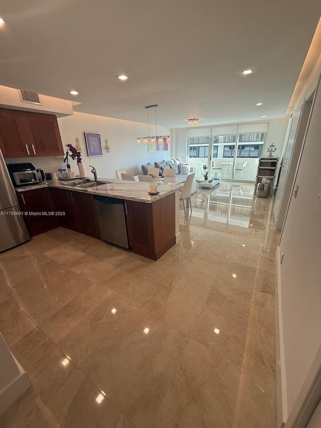 9499 Collins Ave Unit 411, Surfside, FL 33154 - kitchen with dishwasher, a peninsula, light stone countertops, open floor plan, and recessed lighting