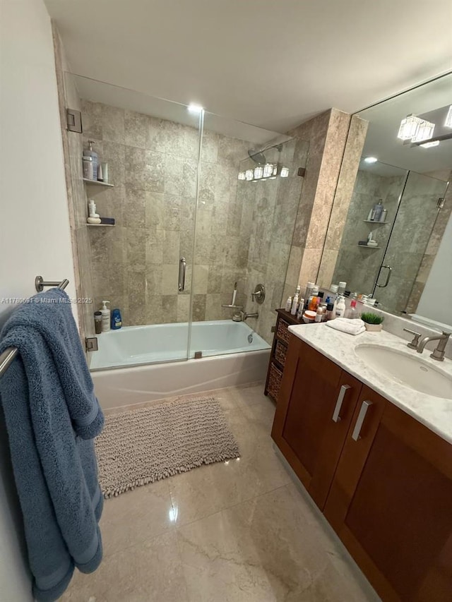 9499 Collins Ave Unit 411, Surfside, FL 33154 - bathroom featuring combined bath / shower with glass door and vanity
