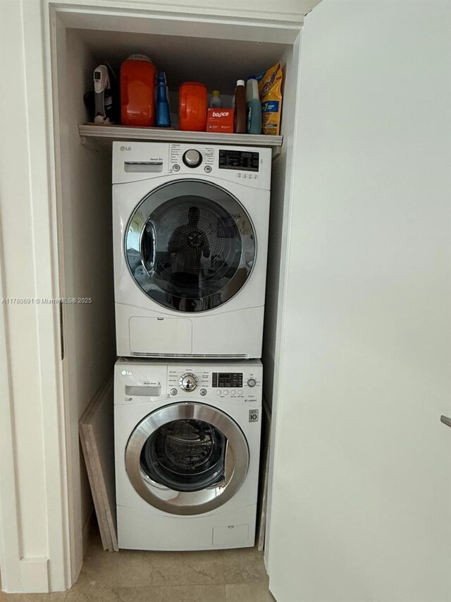 9499 Collins Ave Unit 411, Surfside, FL 33154 - laundry room with stacked washer / drying machine