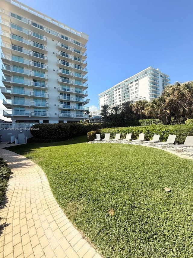 9499 Collins Ave Unit 411, Surfside, FL 33154 - surrounding community with a lawn