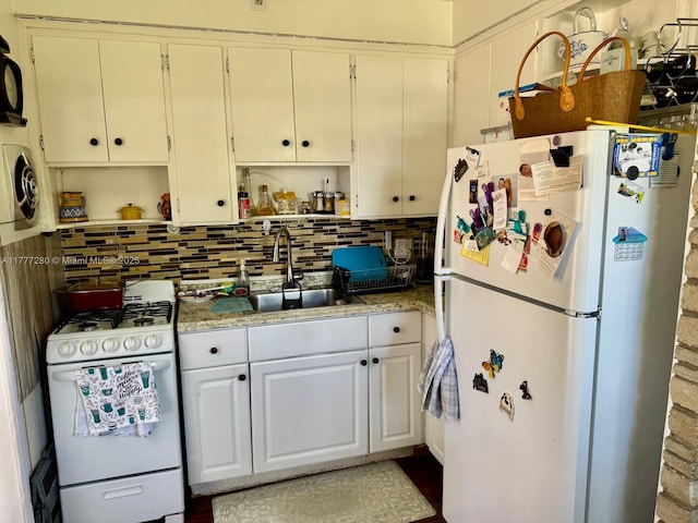 1734 Wiley St, Hollywood, FL 33020 - kitchen featuring open shelves, a sink, light countertops, white appliances, and decorative backsplash