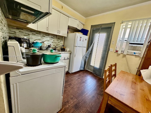 1734 Wiley St, Hollywood, FL 33020 - kitchen with freestanding refrigerator, washer / clothes dryer, tasteful backsplash, ornamental molding, and light countertops