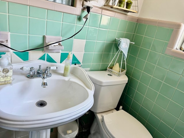 1734 Wiley St, Hollywood, FL 33020 - half bathroom featuring a sink, tile walls, and toilet