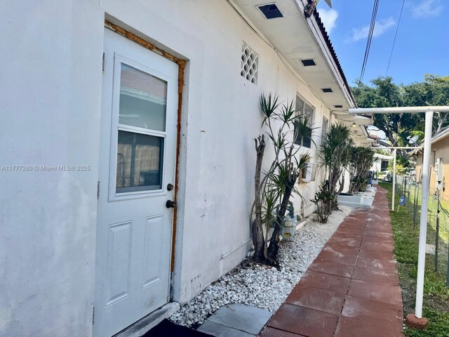 1734 Wiley St, Hollywood, FL 33020 - view of exterior entry featuring stucco siding