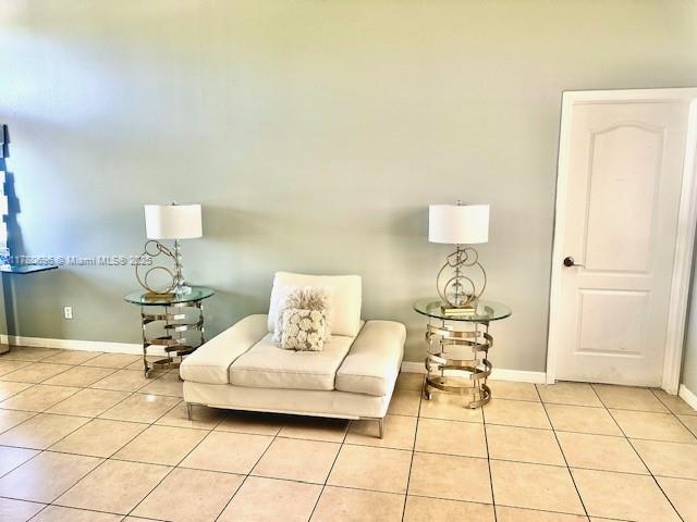 3315 18 W, Lehigh Acres, FL 33971 - living area with light tile patterned floors and baseboards