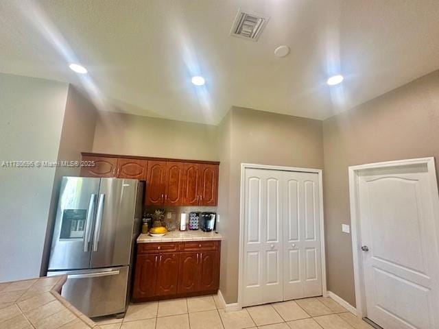 3315 18 W, Lehigh Acres, FL 33971 - kitchen featuring light tile patterned floors, visible vents, recessed lighting, stainless steel refrigerator with ice dispenser, and tile counters