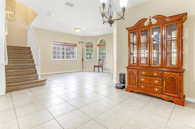 14070 SW 50th Ct, Miramar, FL 33027 - dining space featuring stairway, a chandelier, light tile patterned floors, and baseboards