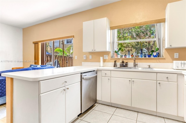 14070 SW 50th Ct, Miramar, FL 33027 - kitchen featuring a sink, a peninsula, dishwasher, and light countertops