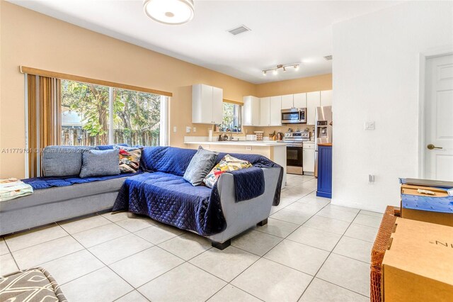 14070 SW 50th Ct, Miramar, FL 33027 - living room featuring light tile patterned flooring