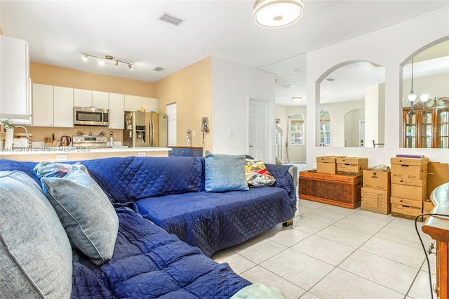 14070 SW 50th Ct, Miramar, FL 33027 - living room with light tile patterned floors and arched walkways