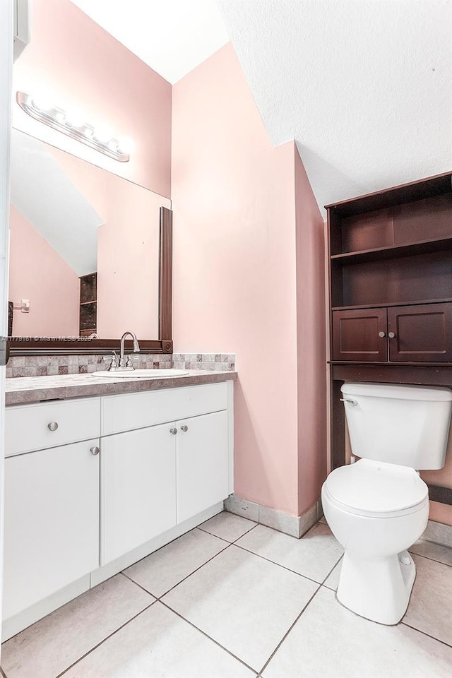 14070 SW 50th Ct, Miramar, FL 33027 - bathroom with toilet, vanity, tile patterned floors, and baseboards