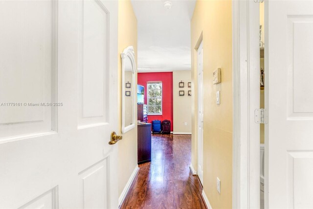 14070 SW 50th Ct, Miramar, FL 33027 - hallway featuring dark wood-style flooring and baseboards