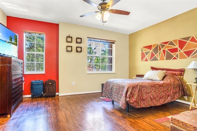 14070 SW 50th Ct, Miramar, FL 33027 - bedroom with wood finished floors, baseboards, and a ceiling fan