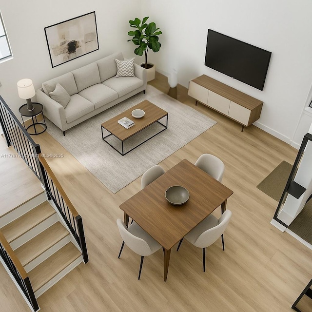 331 Ives Dairy Rd Unit 331-09, Miami, FL 33179 - living room featuring light wood-type flooring, baseboards, and stairs