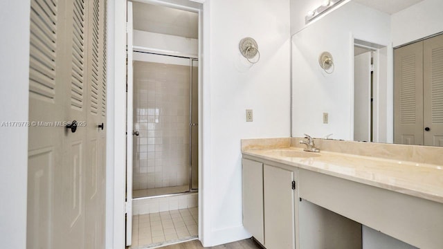 331 Ives Dairy Rd Unit 331-09, Miami, FL 33179 - full bath featuring a closet, a stall shower, vanity, wood finished floors, and baseboards