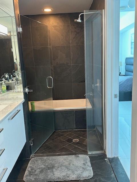 bathroom with vanity, a stall shower, recessed lighting, and tile patterned flooring