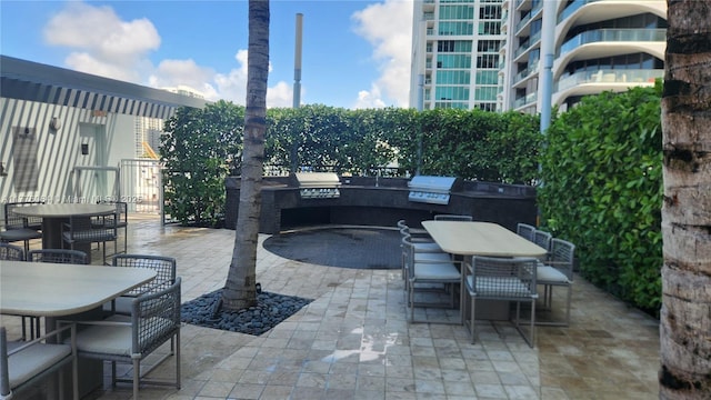 view of patio featuring outdoor dining space and area for grilling