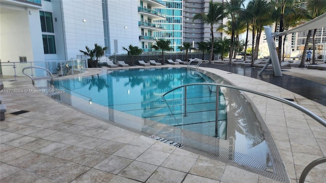 community pool featuring fence