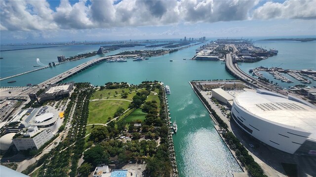 bird's eye view of a nearby body of water, a notable bridge, and numerous boat docks
