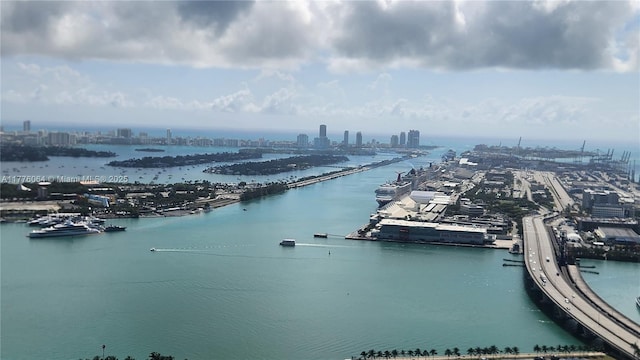 water view featuring nearby urban area and a notable bridge