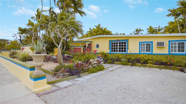 single story home featuring stucco siding