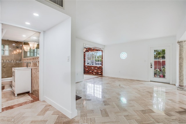 foyer entrance featuring baseboards, visible vents, and recessed lighting