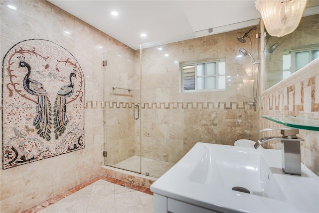 full bath with tile walls, a sink, recessed lighting, and a stall shower