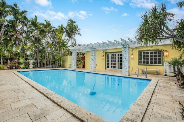 pool featuring a pergola, a patio, and french doors