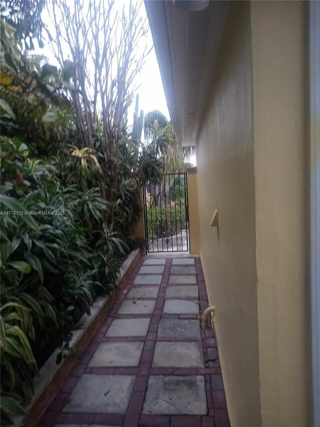 exterior space featuring a gate and stucco siding